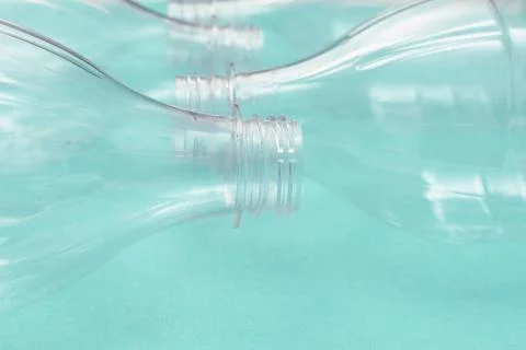 Set of empty plastic bottles on a turquoise background. The problem of plastic Stock Photos