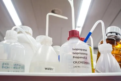 Set of empty plastic chemical bottles with straws in a lab environment Isopro Stock Photos