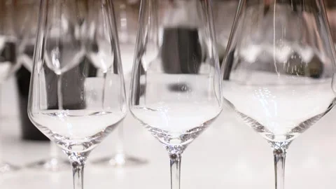 A set of empty transparent wine and champagne glasses on high legs close up Stock Footage 273572460