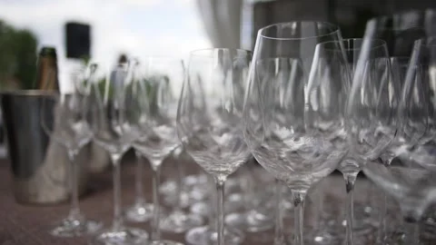 A set of empty transparent wine and champagne glasses on high legs close up Video stock 277059049