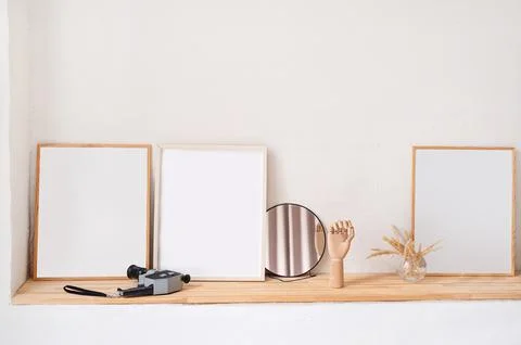 Set of empty wooden photo frames for mockup design on the wooden shelf 스톡 사진