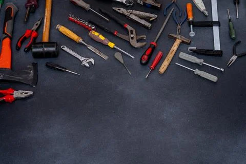 Set Equipment implement Hand Tools on Dark Background copy space. Stock Photos
