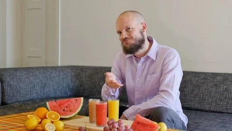 Set of expressions : bearded attractive Man Counting fruits, Happy feeling Stock Footage 112026257