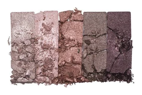 Set of eyeshadow sample isolated on white background. Crushed brown metallic  Stock Photos