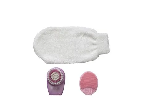 Set of face cleansing tools, glove, silicone sponge and brush isolated on a w Stock Photos