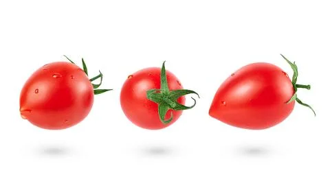 Set of falling tomatoes isolated with clipping path. Full depth Stock Photos