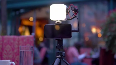 Set for filming a vlog. Video light, microphone, tripod, smartphone Stock Footage 270963339