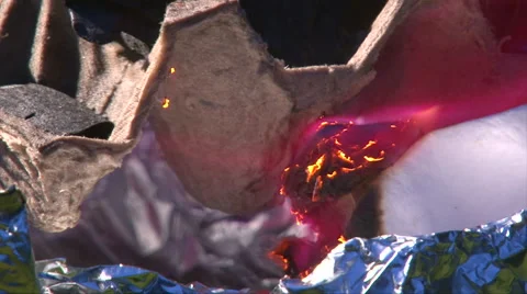 Set fire to coal with burning paper, close up shoot Video stock 63211634
