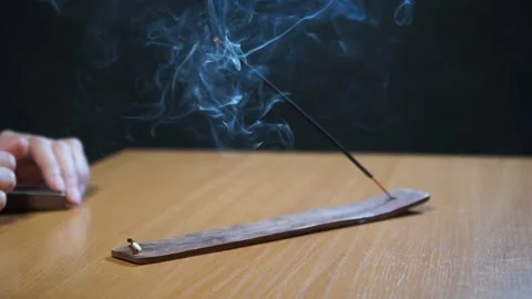 Set a fire of incense stick with smoke. Video stock 164059161