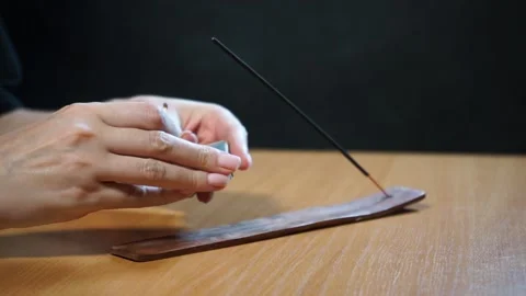 Set a fire of incense stick with smoke. Video stock 164059506