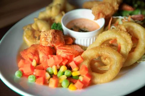 Set of fish steak and vegetable taken with window natural light Stock Photos