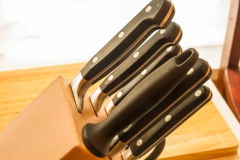 Set of five cooks knives in block. Stock Photos