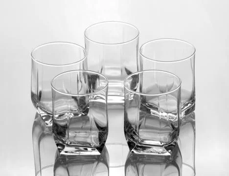 Set of five empty glasses Stock Photos