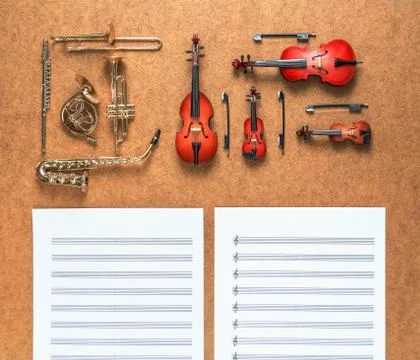 Set of five golden brass wind and four string musical orchestra instruments Stock Photos