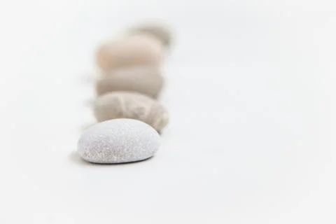 Set of five pebbles on the white background Stock Photos
