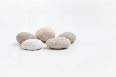 Set of five pebbles on the white background Stock Photos