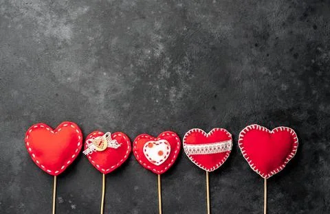 Set of five red heart-shaped cookies with different decorations Stock Photos