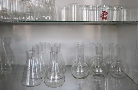 Set of flasks and measuring cups Stock Photos