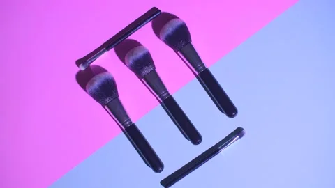 Set of flat top view of professional female cosmetics brush for makeup on pink Stock Footage 132119882
