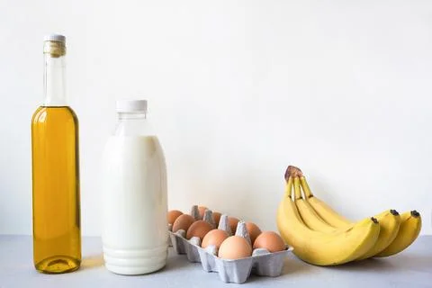 Set of fresh products milk, eggs, olive oil, bananas. Online purchase from .. Stock Photos