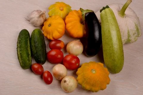 A set of fresh vegetables on a bright kitchen table background Stock Photos