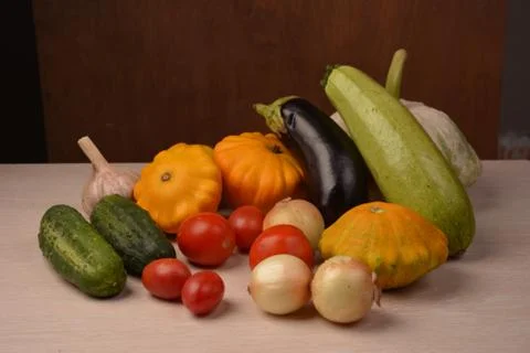 A set of fresh vegetables on a bright kitchen table background Stock Photos