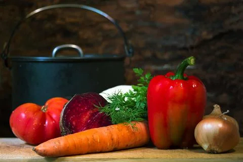 Set of fresh vegetables close-up on a cutting board for cooking vegetarian so Stock Photos