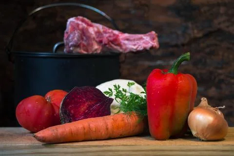 A set of fresh vegetables in close-up on a cutting board for cooking borscht Stock Photos