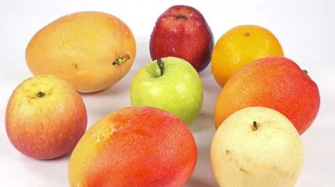 Set fruit isolated on white background. Mango, apple, orange close-up rotation. Stock Footage 63508534