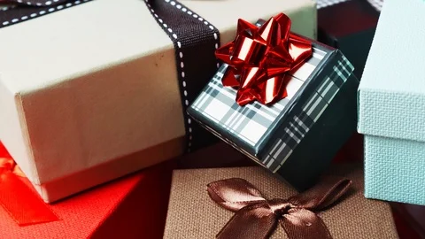 Set of gift boxes of different sizes and colors. Dolly Out Shot. 4K Stock Footage 121425295