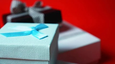 Set of gift boxes of different sizes and colors. Dolly Shot. 4K Stock Footage 121425938