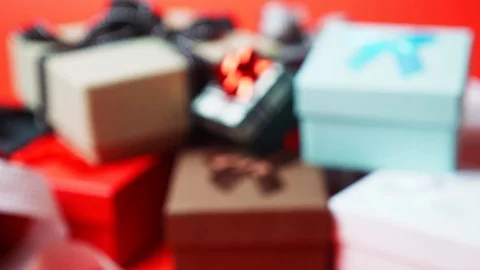 Set of gift boxes of different sizes and colors. Dolly In Shot from Out of Focus Stock Footage 121426016