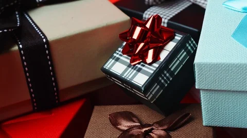 Set of gift boxes of different sizes and colors. Dolly Out Shot. 4K Slow Motion Stock Footage 121426065