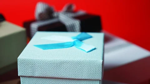 Set of gift boxes of different sizes and colors. Dolly Shot. 4K Stock Footage 128033800