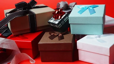 Set of gift boxes of different sizes and colors. Dolly In Shot. Slow Motion. 4K Stock Footage 128837290