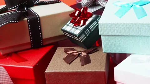 Set of gift boxes of different sizes and colors. Dolly In Shot. 4K Stock Footage 145217031