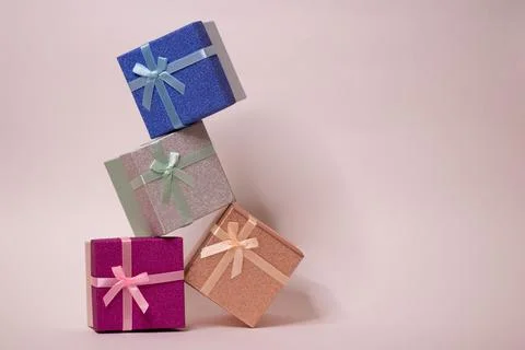 A set of gift boxes on a white background. Crafts made of needlework and colored Stock Photos