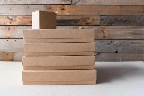 Set of gift cardboard boxes different sizes on wooden background Stock-Fotos