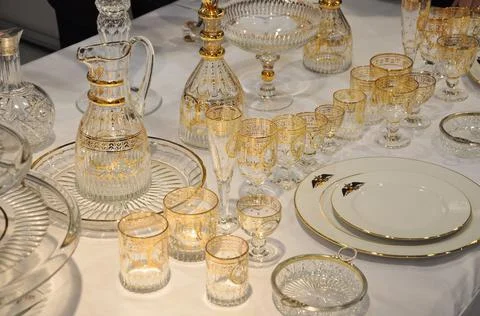 Set of glass tableware with gilding. Stock Photos