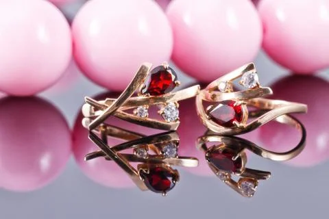 Set of gold jewelry with ruby and large pink beads 写真素材
