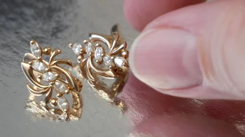 Set golden ring and earring on silver background, jewelry shop Video stock 285225283