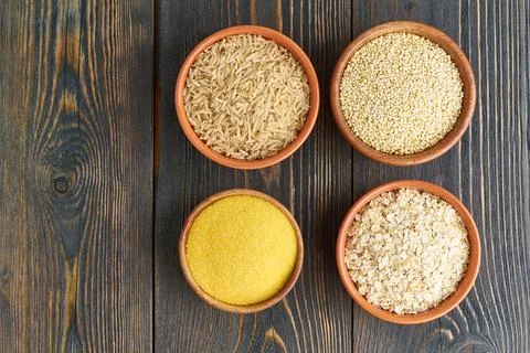 Set of groats for gluten-free fodmap diet, long carbohydrates, brown rice, corn Stock Photos