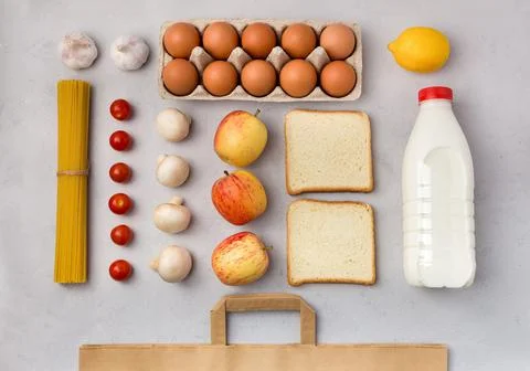 Set of grocery items flat lay on gray background. Online order of nutrition.  Stock Photos
