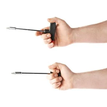 Set of hand holding a T-shape screwdriver tool, composition isolated over the Stock Photos