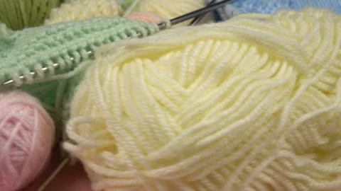 Set for hand knitting, multi colored yarn, knitted swatches Stock Footage 267223686