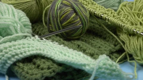 Set for hand knitting, yarn in the green tones, green knitted item Stock Footage 267224129