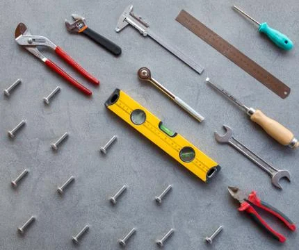 Set of hand tools on a gray background Stock Photos