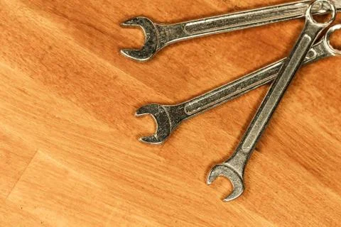 Set of hand tools three wrenches used to fix bolts lies ha wooden background Stock Photos