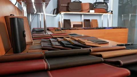 Set of handmade leather goods, key holder rings, wallet, purse, notepad Stock Footage 125446369