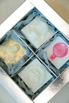 A set of handmade soaps with a relief pattern in a silver box Stock Photos